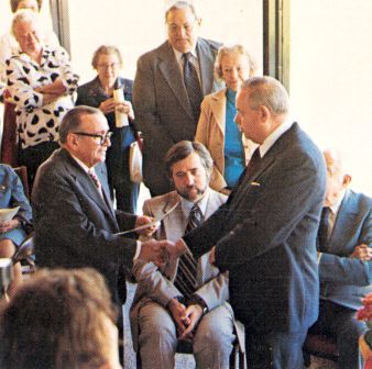 Moore1980.jpg - Dr. Wilmon H. Droze presents to Mr. Stanley Moore a certificate of dedication naming Moore Building in his honor