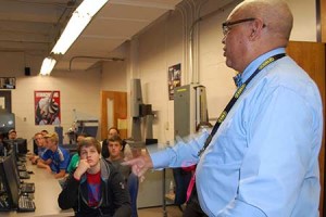 Instructor with students in a computer lab