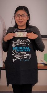 Photo of Monica Castro and her award winning t-shirt.