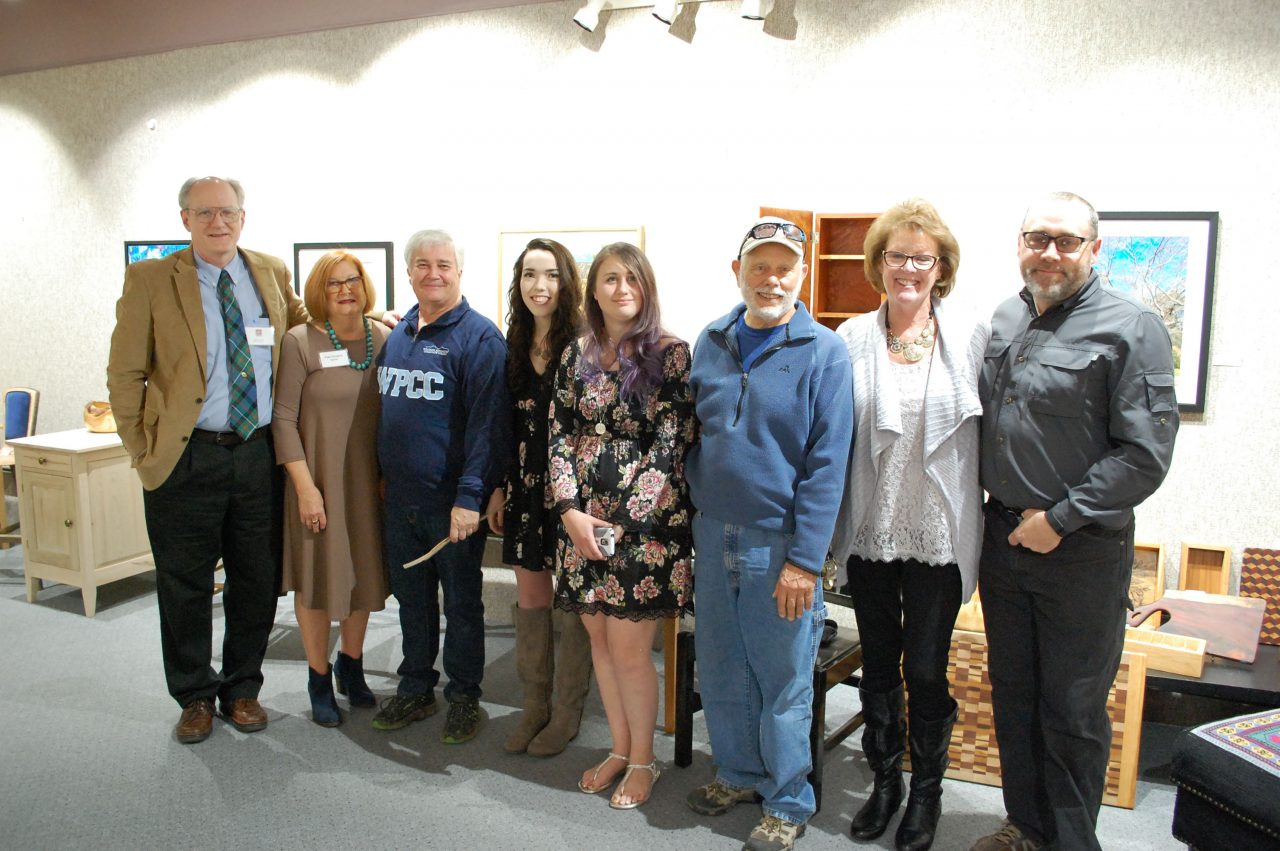 Photo of professional crafts wood students and instructor at the art gallery. 