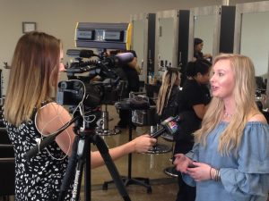 Photo of program coordinator being interviewed.