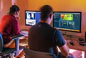 Two WPCC students work at computers in the Digital Effects and Animation Technology Program