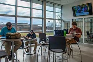 WPCC students study in a foyer in the Mechatronics Building on the Main Campus