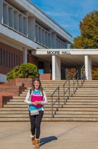 Photo of aWPCC student leaving Moore Hall
