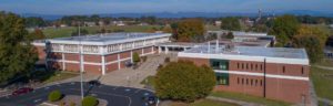 Aerial Photo of the WPCC Main Campus with Table Rock and Hawksbill Mountains in the Background