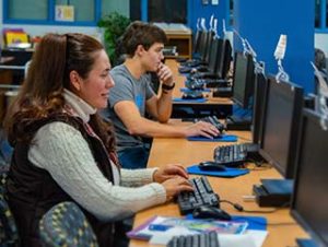 Photo of two WPCC students working at computers in the WPCC Library
