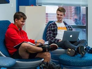 Photo of two WPCC students working on a project