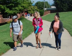 Photo of three WPCC students walking on campus