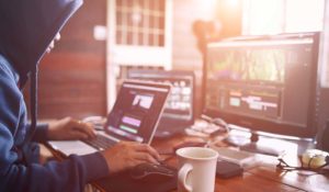 Image of someone using multiple screens