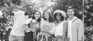 Five happy student pose for the camera