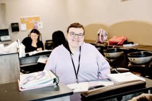 Image of cosmetology student smiling for a photo.