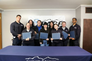 Image of ems students graduating with certificates