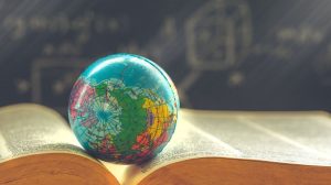 Image of globe on a textbook.