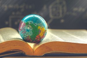Image of a globe on a textbook.