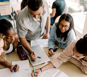 Image of students working together.
