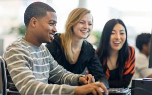 Image of 3 students smiling.