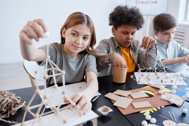 gear up; kids making wooden models